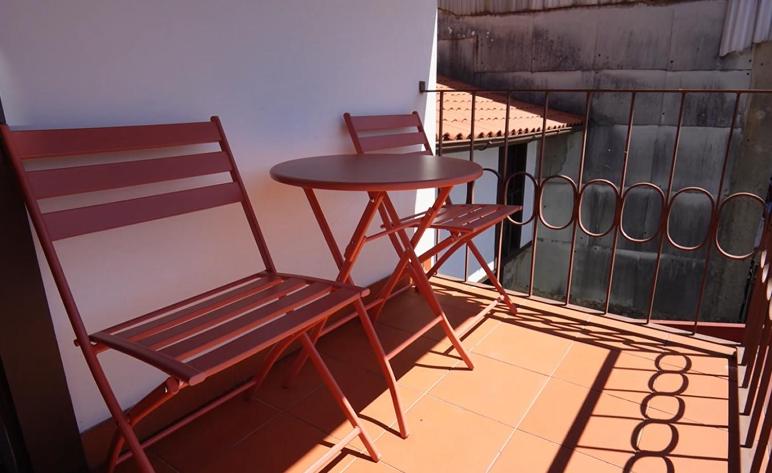 Quarto com varanda em Guimarães
